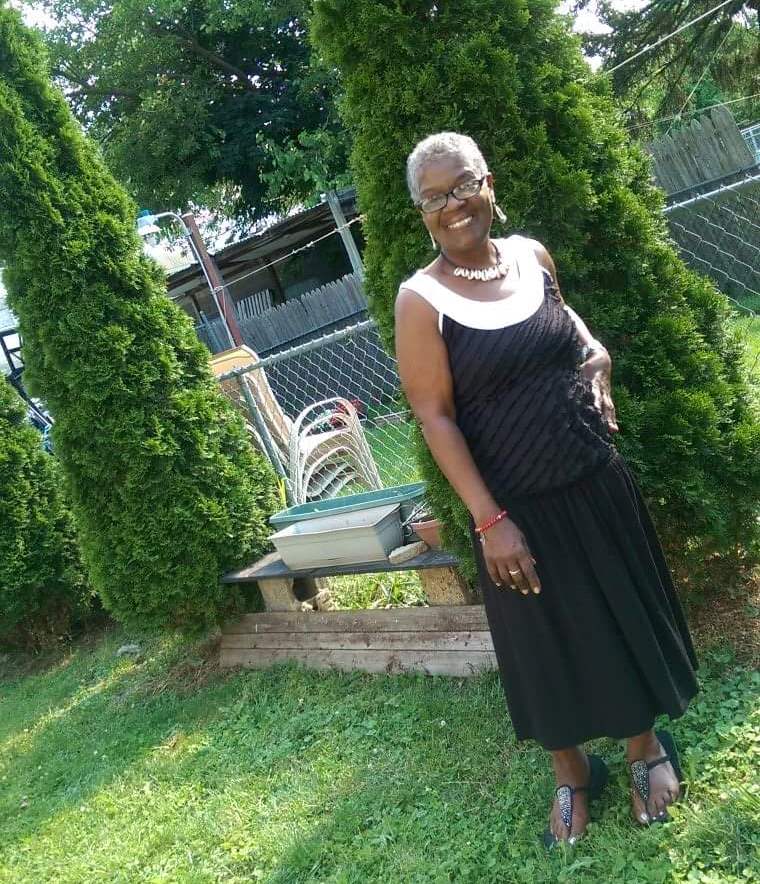 Rosalynn standing proudly next to her tree.